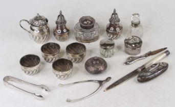 Assorted silver wares to inlcude various salts, silver topped jars, pepperettes, mustard, wishbone