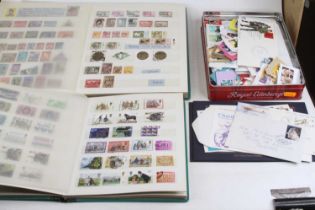 Two stamp albums and contents, together with a collection of loose stamps