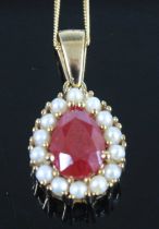 A 9ct yellow gold, ruby and pearl pear shaped cluster pendant, the ruby measuring approx 9 x 6.15