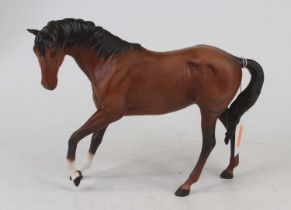 A Beswick matt painted pottery figure of a chestnut horse, h.18cm Appears in good condition, free