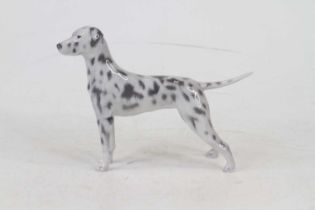 A Royal Copenhagen porcelain figure of a Dalmatian, modelled standing, h.13cm Light firing crack