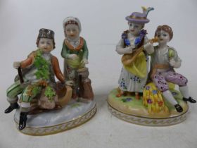 A 20th century Dresden porcelain figure, modelled as man & wife the woodcutters, decorated in bright