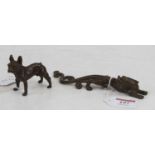 A bronzed metal figure of a French bulldog, h.6cm; together with another of a dragon, length 16cm