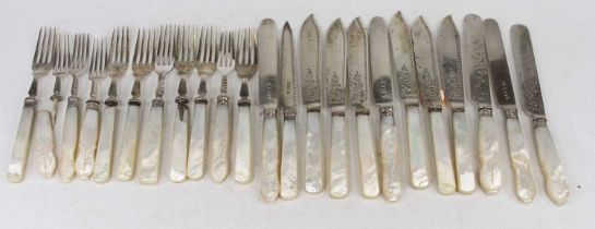 A collection of silver bladed and mother of pearl handled cake and dessert knives and forks, various