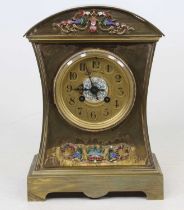 A 19th century brass eight-day mantel clock, the dial showing Arabic numerals and signed W