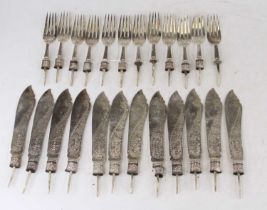 A collection of silver fish knives and forks, all lacking their handles and sold as scrap, gross