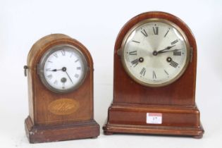 An Edwardian mahogany and boxwood strung mantel clock, h.20cm; together with another similar (2)