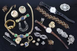 A bag of assorted costume jewellery, fashion watches, brooches etc