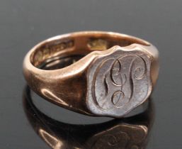 A late Victorian gentlemans 9 carat gold signet ring with engraved monogram, size U/V, sponsors mark