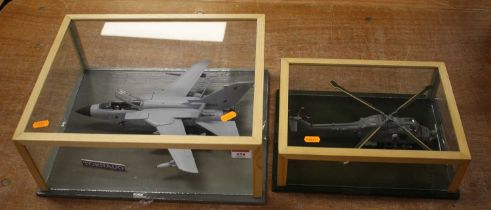 A cased scratch built scale model of a Tornado aeroplane and a Royal Navy helicopter