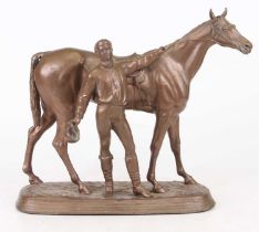 A gilt spelter model of a horse and jockey, h.25cm