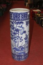 A Chinese blue and white pottery stickstand, decorated with birds amongst flowers and bamboo, h.