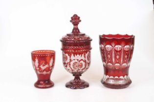 A 19th century ruby overlaid glass vase, h.18cm; together two other similar (3)