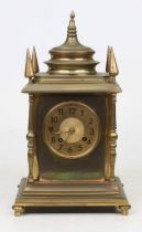 A 19th century brass eight-day mantel clock, the gilt dial showing Arabic numerals, striking on a