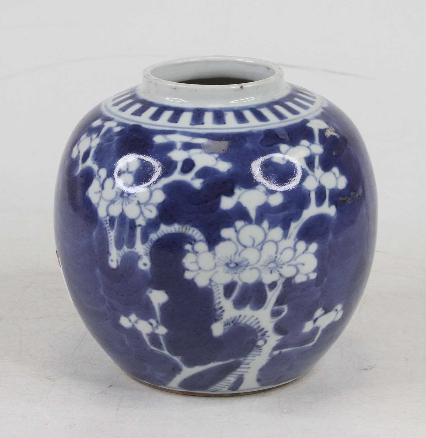 A Chinese blue and white porcelain ginger jar in the prunus pattern (lacking lid), h.12cm