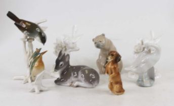 A Royal Copenhagen porcelain figure of a fawn, h.9cm; together with a Lladro figure of a bear, and
