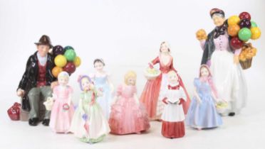 A collection of nine Royal Doulton figures to include Biddy Penny Farthing, height 23cm, and The