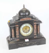 A 19th century black slate and rouge marble mantel clock, of architectural form, the enamelled