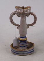 An Italian tin-glazed earthenware candlestick, possibly Caltagirone, h.23cm