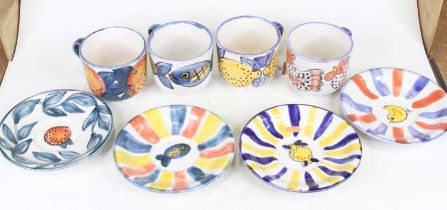 A set of four Kate Glanville tea cups and saucers, saucer dia.18cm