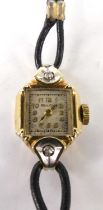 A lady's Bulova 14ct gold cased dress watch, the lugs each set with a small round cut diamond, the