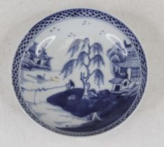 A Chinese blue and white porcelain dish, underglaze decorated with a fisherman within a landscape,