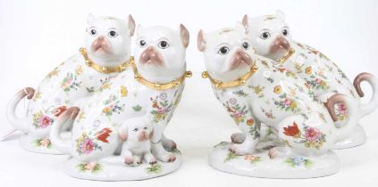 A set of four 20th century porcelain models of dogs, each h.19cm All in good order.