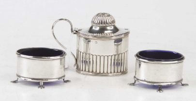 A pair of George V silver open table salts, each with blue glass liners, width 5.5cm, together