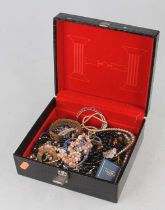 A jewellery box and contents of assorted costume, largely being necklaces but to include hinge