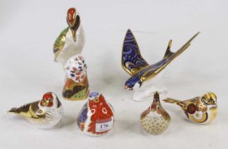 A Royal Crown Derby porcelain paperweight in the form of a swallow, having a gold stopper, h.13cm;