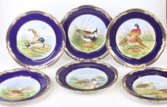A set of six Spode porcelain Game Birds series plates, each dia.24cm; together with a pair of