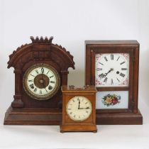 An American faded mahogany cased mantel clock, having unsigned dial, h.33cm; together with a circa