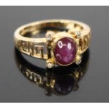 A 9ct gold star sapphire and cz set dress ring with Greek key shoulders, 2.7g, size N