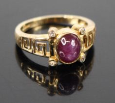 A 9ct gold star sapphire and cz set dress ring with Greek key shoulders, 2.7g, size N