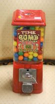 A coin-operated gobstopper dispenser with contents