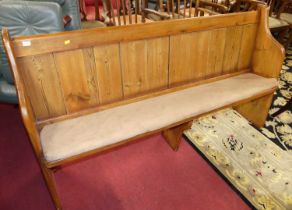 A rustic stained and planked pine long church pew, length 170cm