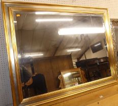 A contemporary gilt and silvered bevelled rectangular wall mirror, 91 x 116.5cm