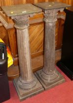 A pair of rustic carved and painted hardwood composition pedestal plant stands, each with typical