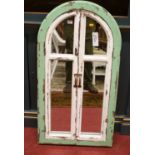 A contemporary French style painted arched wall mirror, with twin shutter doors, 100.5 x 53cm