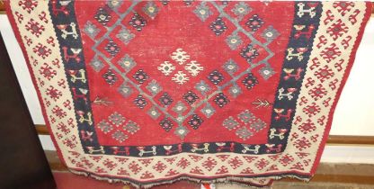 A Turkish red ground Kelim rug, with stylised floral design, 200 x 139cm Some areas of thinning