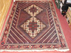 A Persian woollen blue ground Shiraz rug, 174 x 125cm