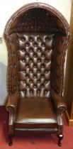 A good quality contemporary chocolate brown leather buttoned and brass studded upholstered porter'