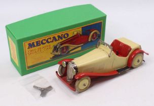 A Meccano No. M223 Non-Constructor's two-seater sports car, comprising of red & cream body with