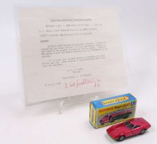 A Matchbox Lesney Superfast No. 52 Dodge Charger MkII, metallic red body, with a metallic green base