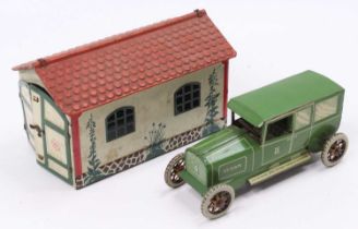 A Lehmann No. 771 tinplate double door garage comprising of cream body with green foliage and