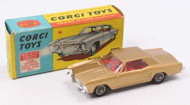 Corgi Toys No. 245 Buick Riviera comprising gold body with red interior and wire wheels, in the