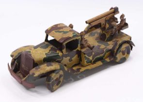 A Wells Brimtoy tinplate and clockwork model of an army lorry fitted with anti aircraft gun, all