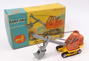 A Corgi Toys No. 1128 Priestman cub shovel, comprising of yellow and orange body with grey boom arm,
