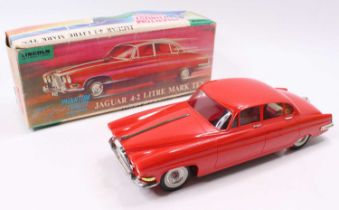 A Lincoln International plastic and battery operated model of a Jaguar 4.2L Mk10 saloon, finished in