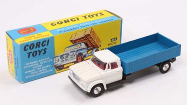 A Corgi Toys No. 483 Dodge Kew Fargo Tipper comprising white cab and blue back with graphite grey